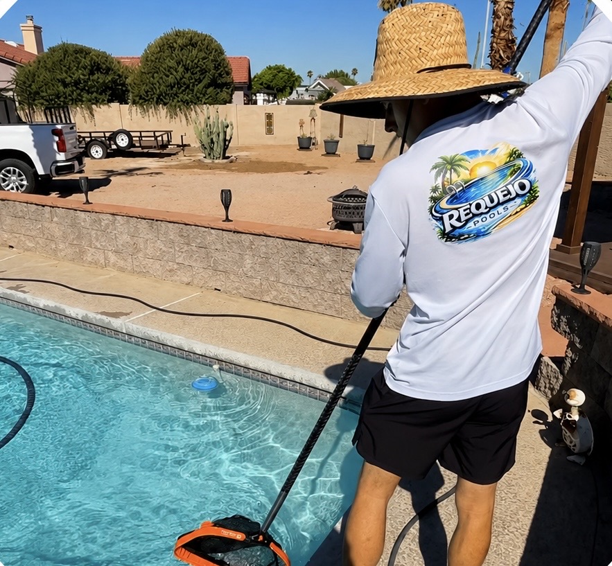 Pool technician cleaning a residential pool in Phoenix